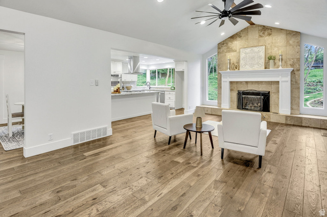 1320 Canyon Park Road Bountiful, UT 84010 - Photo 3 of 28 Sitting room with ceiling fan, light wood finished floors, a tile fireplace, and recessed lighting