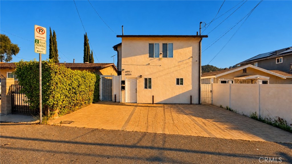 6851 Foothill Boulevard Tujunga, CA 91042 - Photo 6 of 50 a view of a house with wooden fence