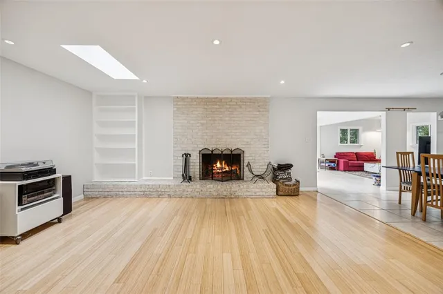 a view of a livingroom with furniture and a fireplace