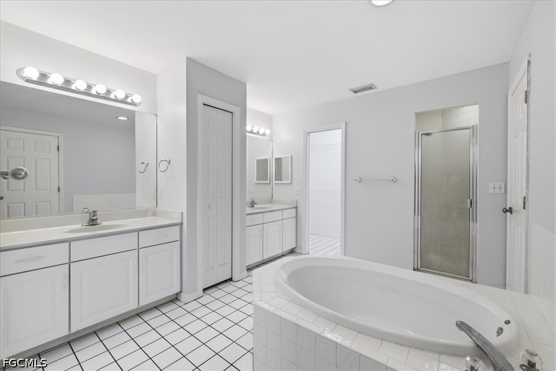 4530 Springview Circle LaBelle, FL 33935 - Photo 23 of 46 a bathroom with a tub sink and mirror