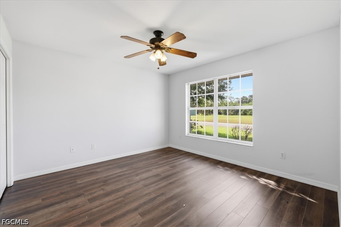 4530 Springview Circle LaBelle, FL 33935 - Photo 28 of 46 a view of an empty room with wooden floor and a window