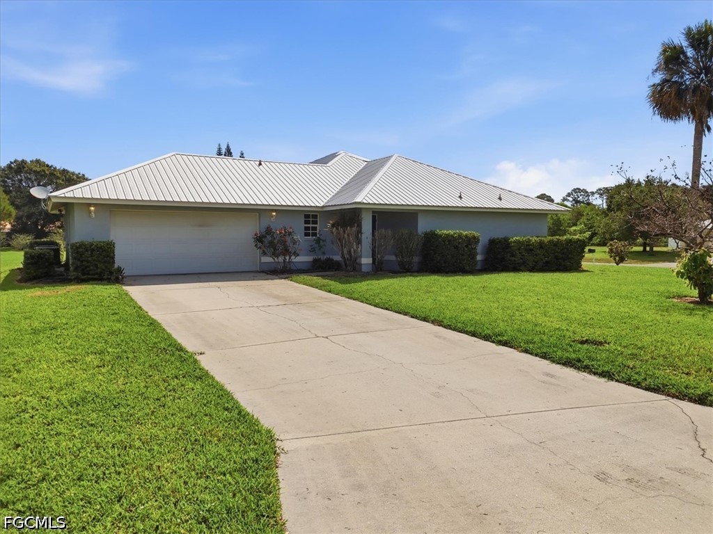 4530 Springview Circle LaBelle, FL 33935 - Photo 40 of 46 a front view of a house with yard patio and green space