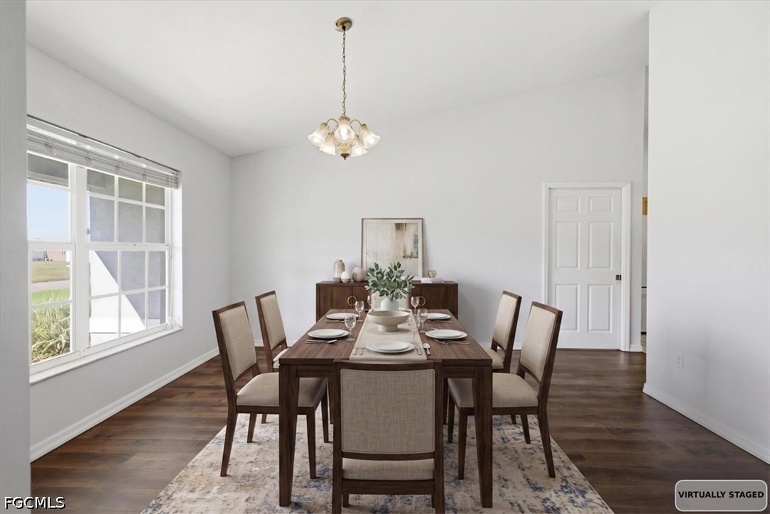 4530 Springview Circle LaBelle, FL 33935 - Photo 4 of 46 a view of a dining room with furniture wooden floor and chandelier