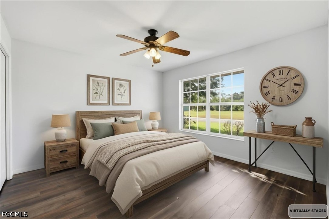 4530 Springview Circle LaBelle, FL 33935 - Photo 6 of 46 a bedroom with a bed and a large window