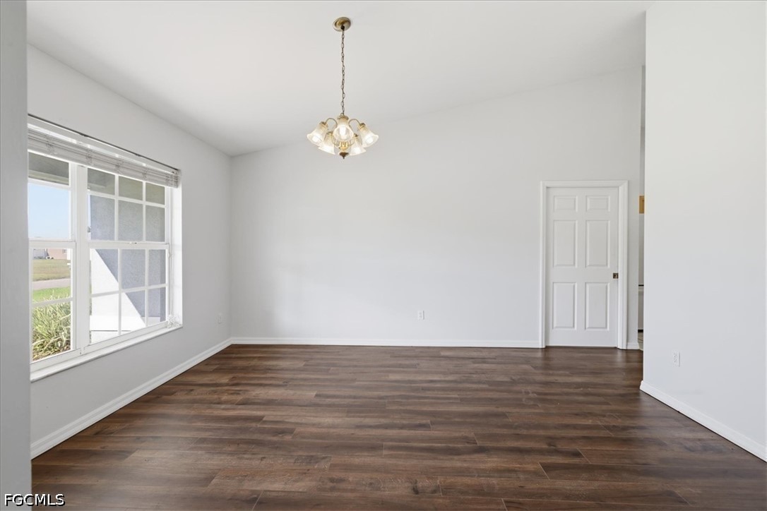 4530 Springview Circle LaBelle, FL 33935 - Photo 9 of 46 an empty room with wooden floor and windows
