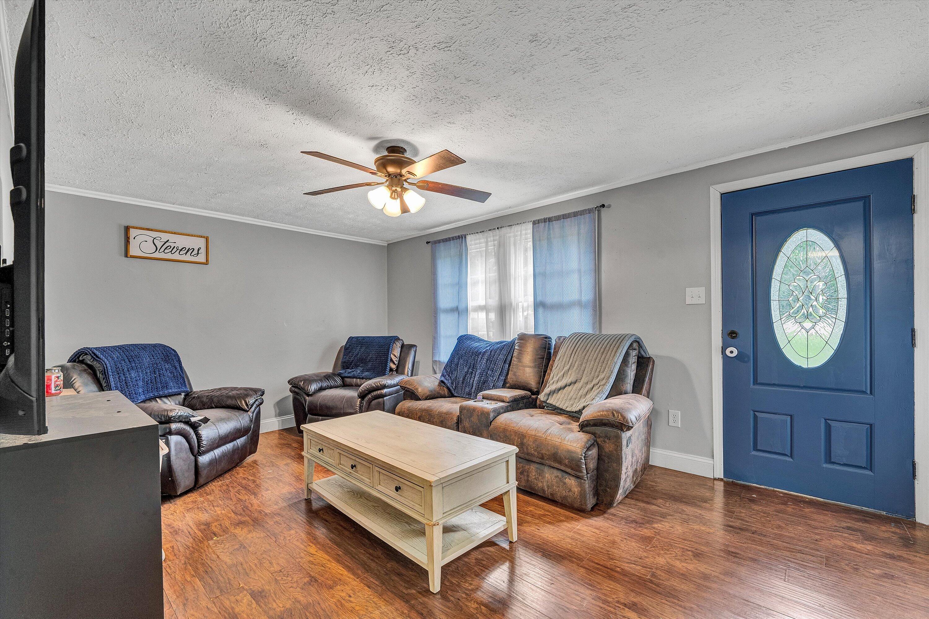2095 Webster Road Glade Hill, VA 24092 - Photo 3 of 20 a living room with furniture a chandelier and a window