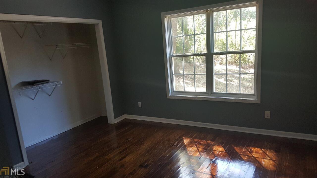 854 Ridge Avenue Northwest, Unit B Atlanta, GA 30318 - Photo 5 of 6 a view of a room with wooden floor and windows