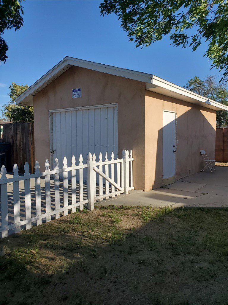 43360-43360 7th Street East Lancaster, CA 93535 - Photo 13 of 14 a front view of a house with garden