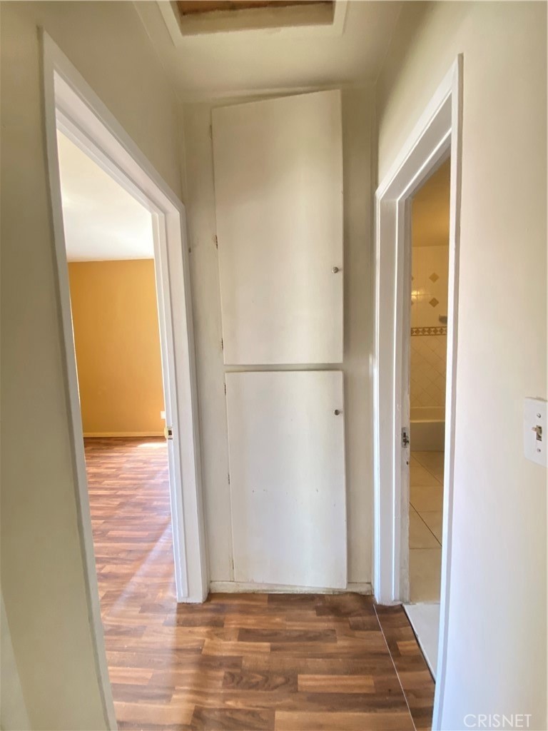 43360-43360 7th Street East Lancaster, CA 93535 - Photo 6 of 14 a view of a hallway with wooden floor and a hallway