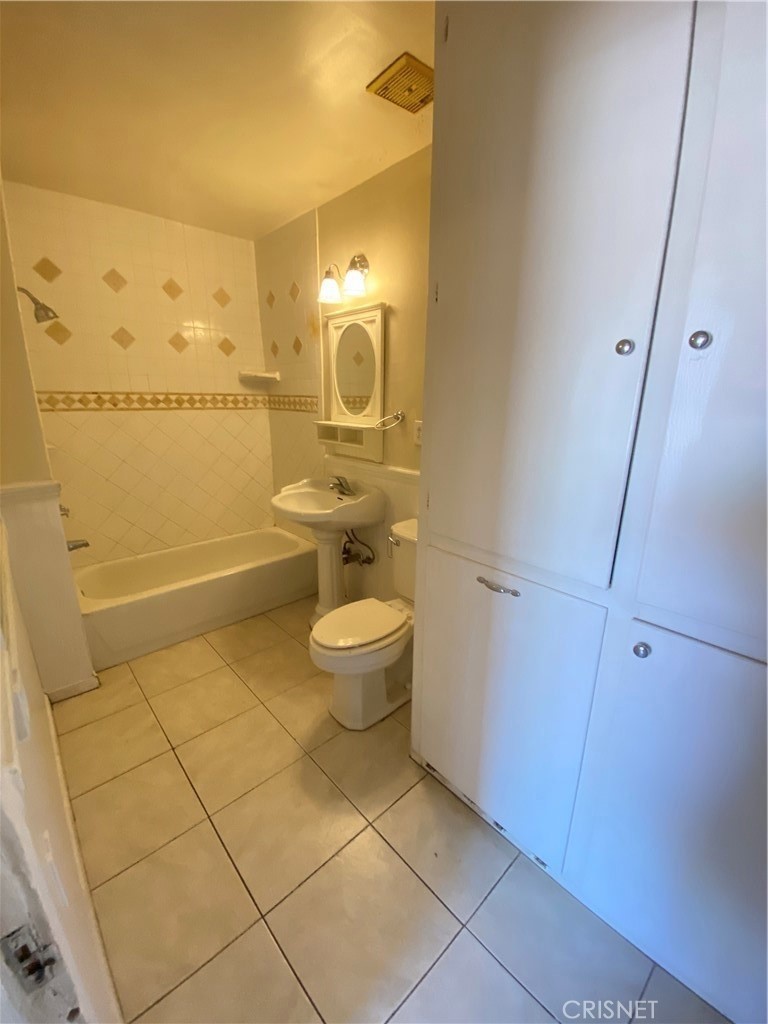 43360-43360 7th Street East Lancaster, CA 93535 - Photo 9 of 14 a bathroom with a toilet and a shower