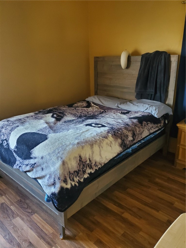 43360-43360 7th Street East Lancaster, CA 93535 - Photo 10 of 14 a bed sitting in a bedroom next to a cabinet