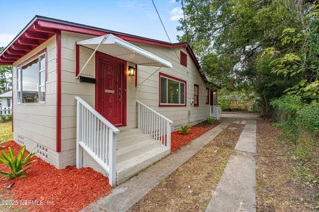 a view of an empty room and a window