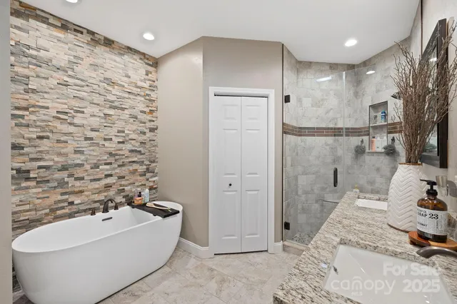 a bathroom with a bathtub and a shower