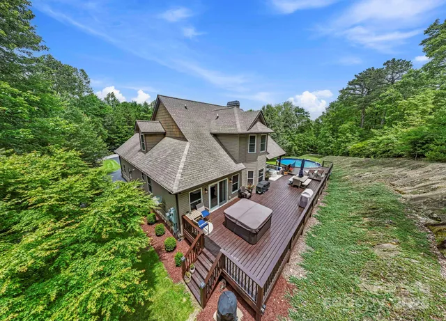 a view of a patio with furniture and a yard