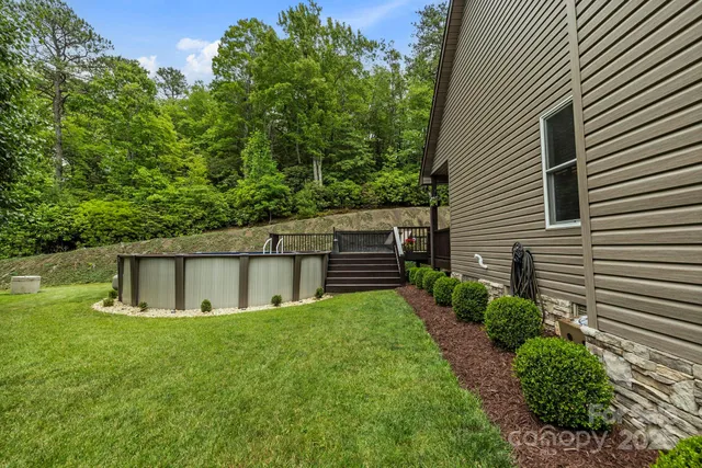 a view of house with backyard