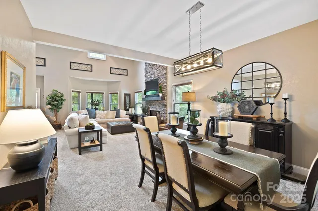 a very nice looking living room with a large window and furniture