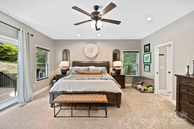 a bed room with a bed and a tv