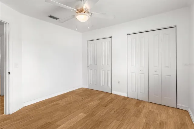 a bathroom with a tub a window and a shower