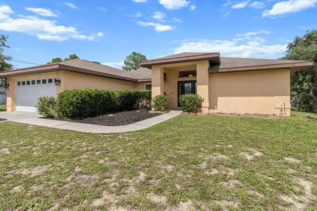 a living room with furniture a flat screen tv and chairs