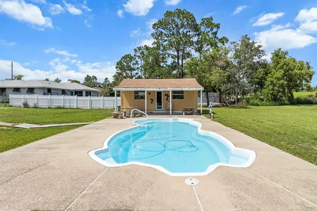 an aerial view of multiple houses with yard