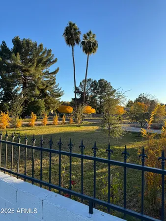 a view of a house with swimming pool and sitting area