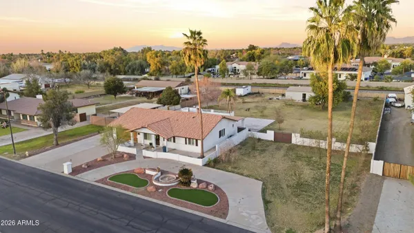 a living room with furniture a fireplace and a table