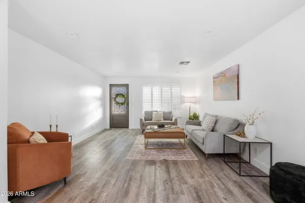 a living room with furniture and a window