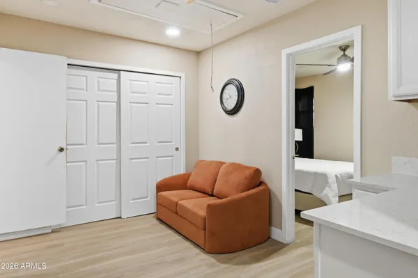 a view of a house with a yard and potted plants