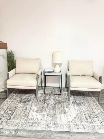 a kitchen with a dining table chairs and white cabinets