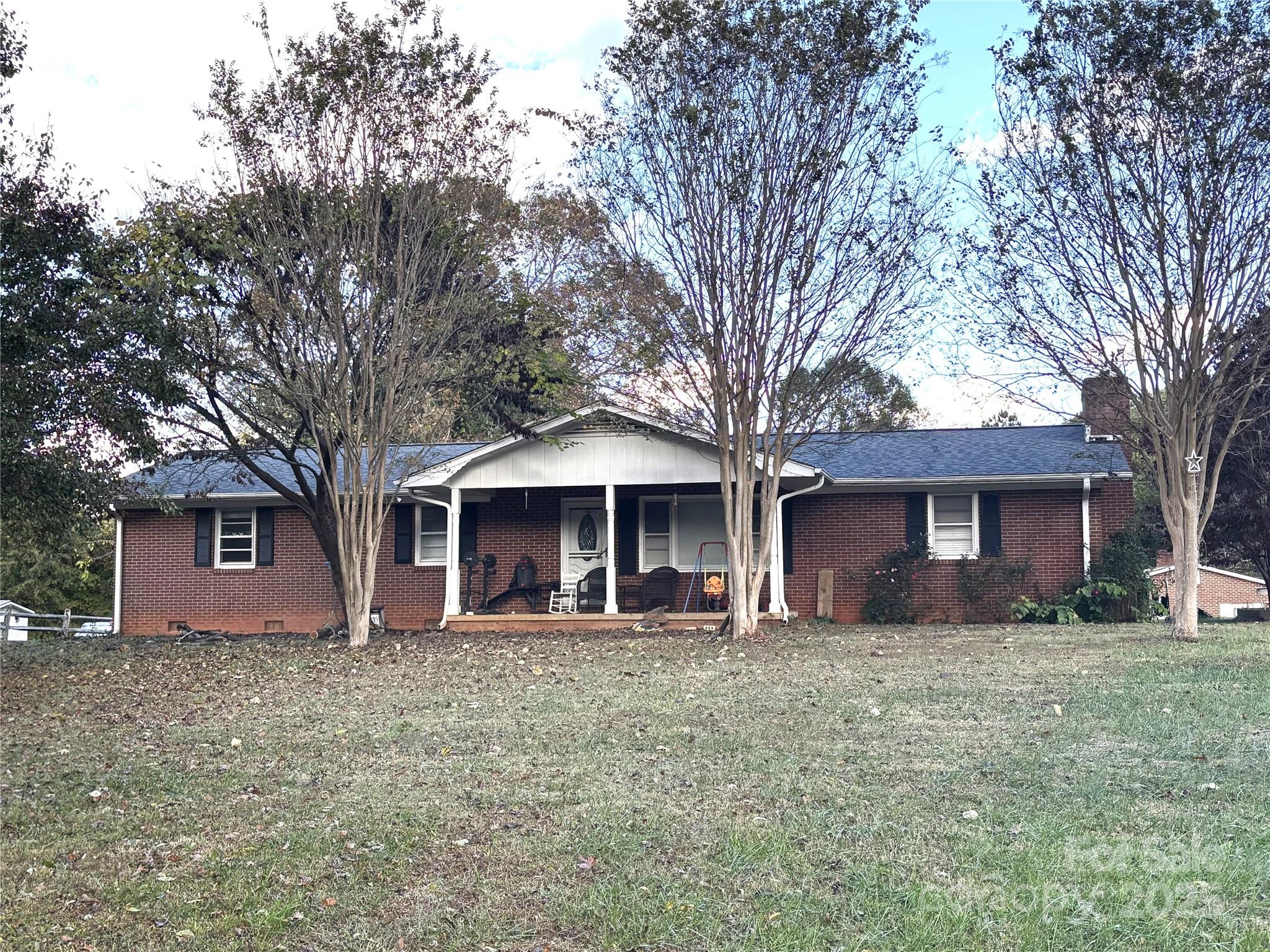 203 Ratchford Farm Road Gastonia, NC 28056 - Photo 1 of 16 a front view of house with yard and trees
