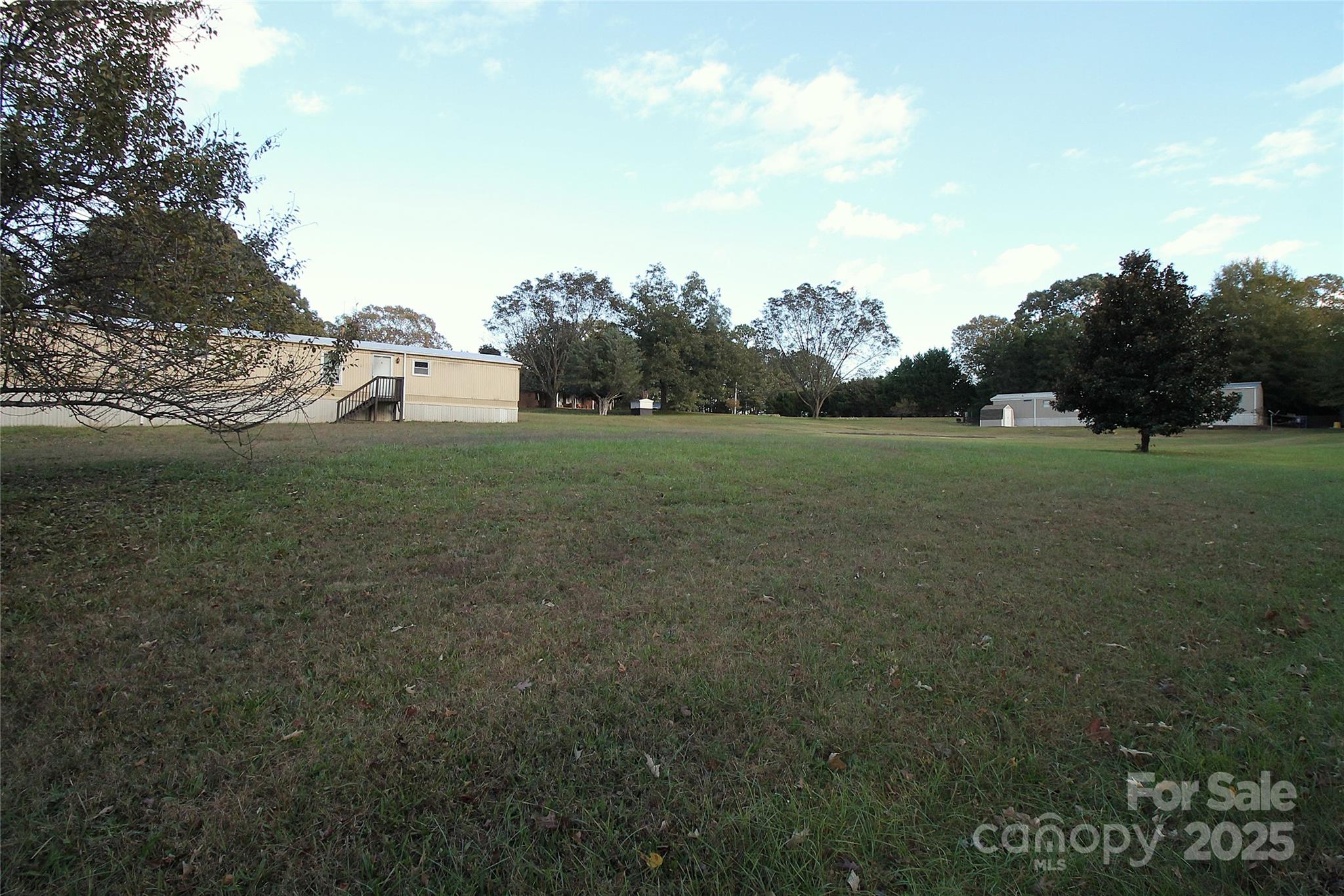 203 Ratchford Farm Road Gastonia, NC 28056 - Photo 11 of 16 a view of a field with trees