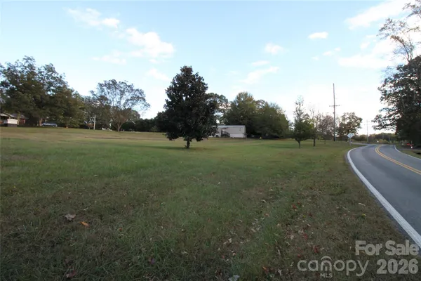 a view of a field with of trees