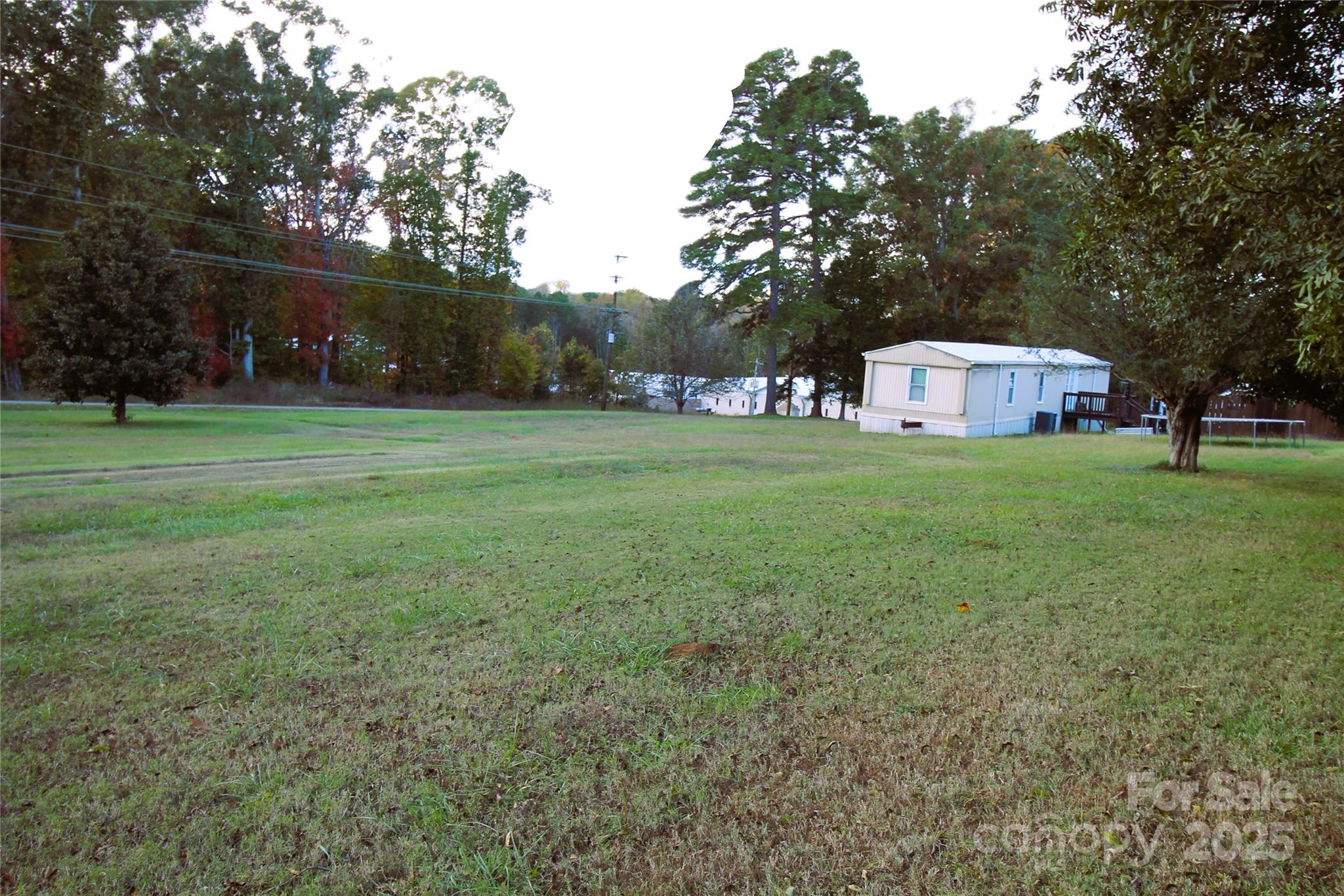 203 Ratchford Farm Road Gastonia, NC 28056 - Photo 13 of 16 a front view of house with yard and trees