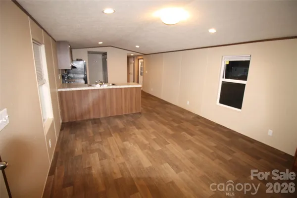 a kitchen with a refrigerator sink and stove