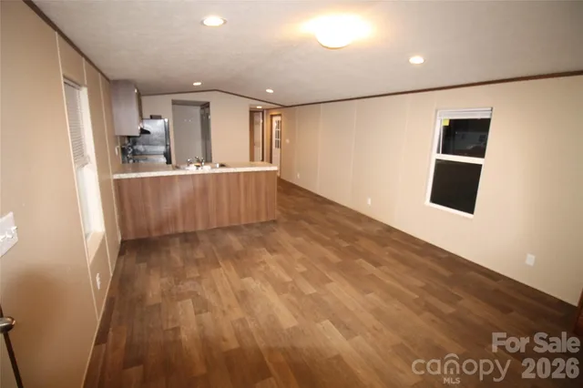 a kitchen with a refrigerator sink and stove