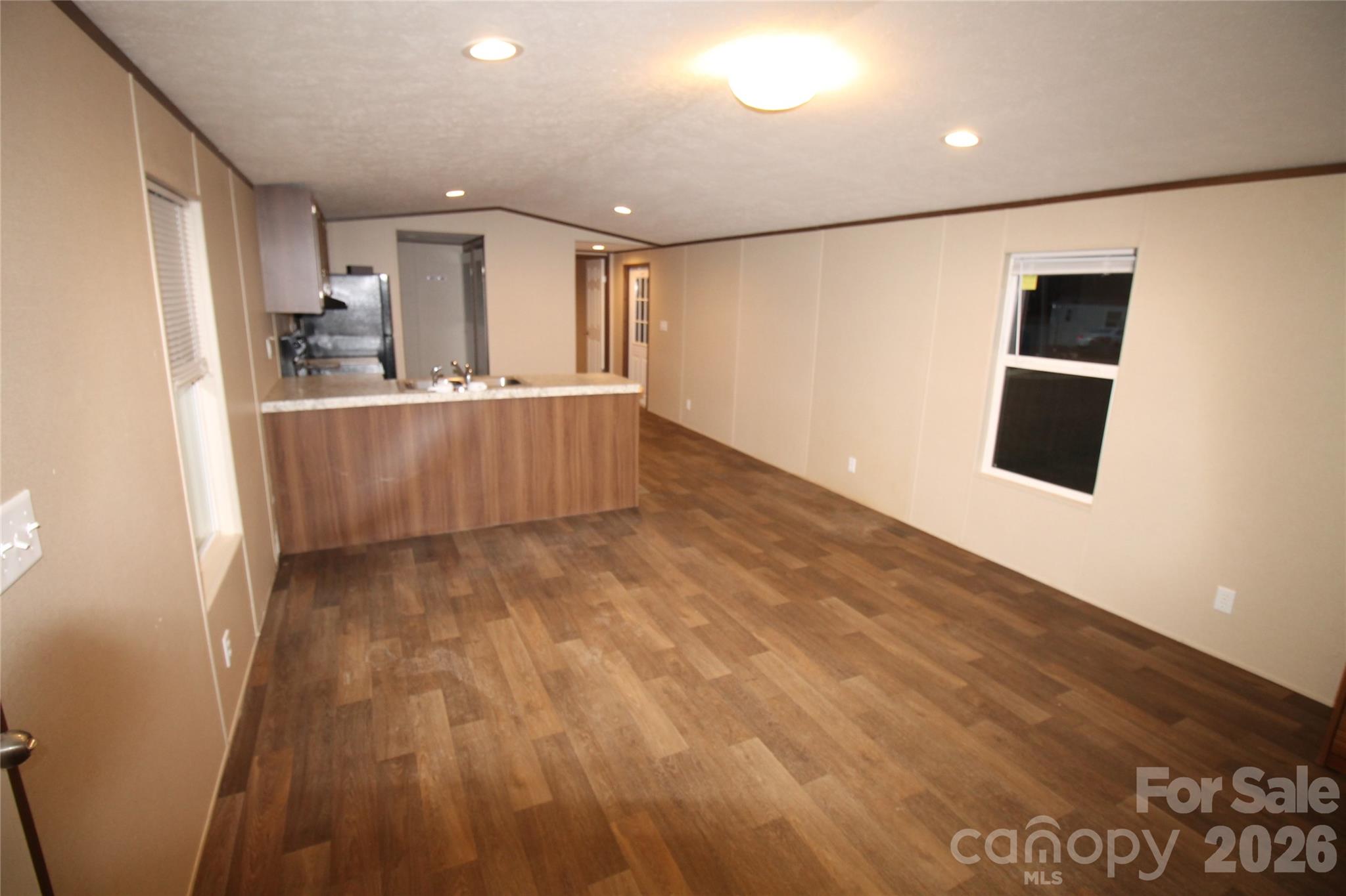 203 Ratchford Farm Road Gastonia, NC 28056 - Photo 15 of 25 a view of kitchen with cabinets and wooden floor