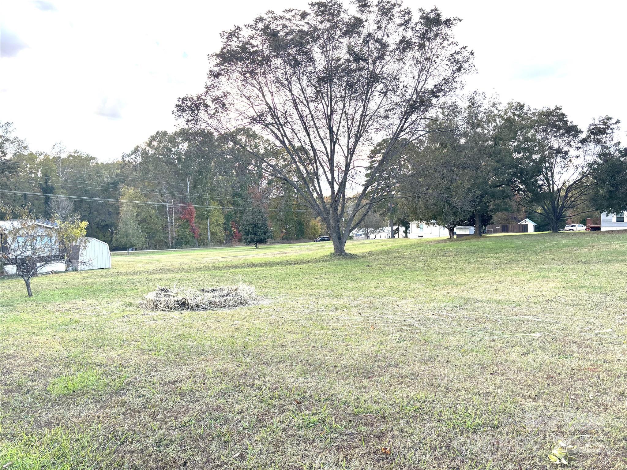 203 Ratchford Farm Road Gastonia, NC 28056 - Photo 16 of 16 a view of a field with a tree