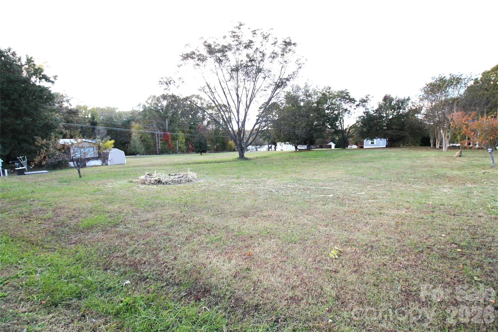 203 Ratchford Farm Road Gastonia, NC 28056 - Photo 37 of 38 a view of field with trees in the background
