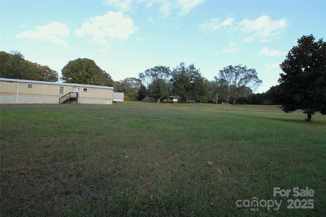 a view of backyard with green space