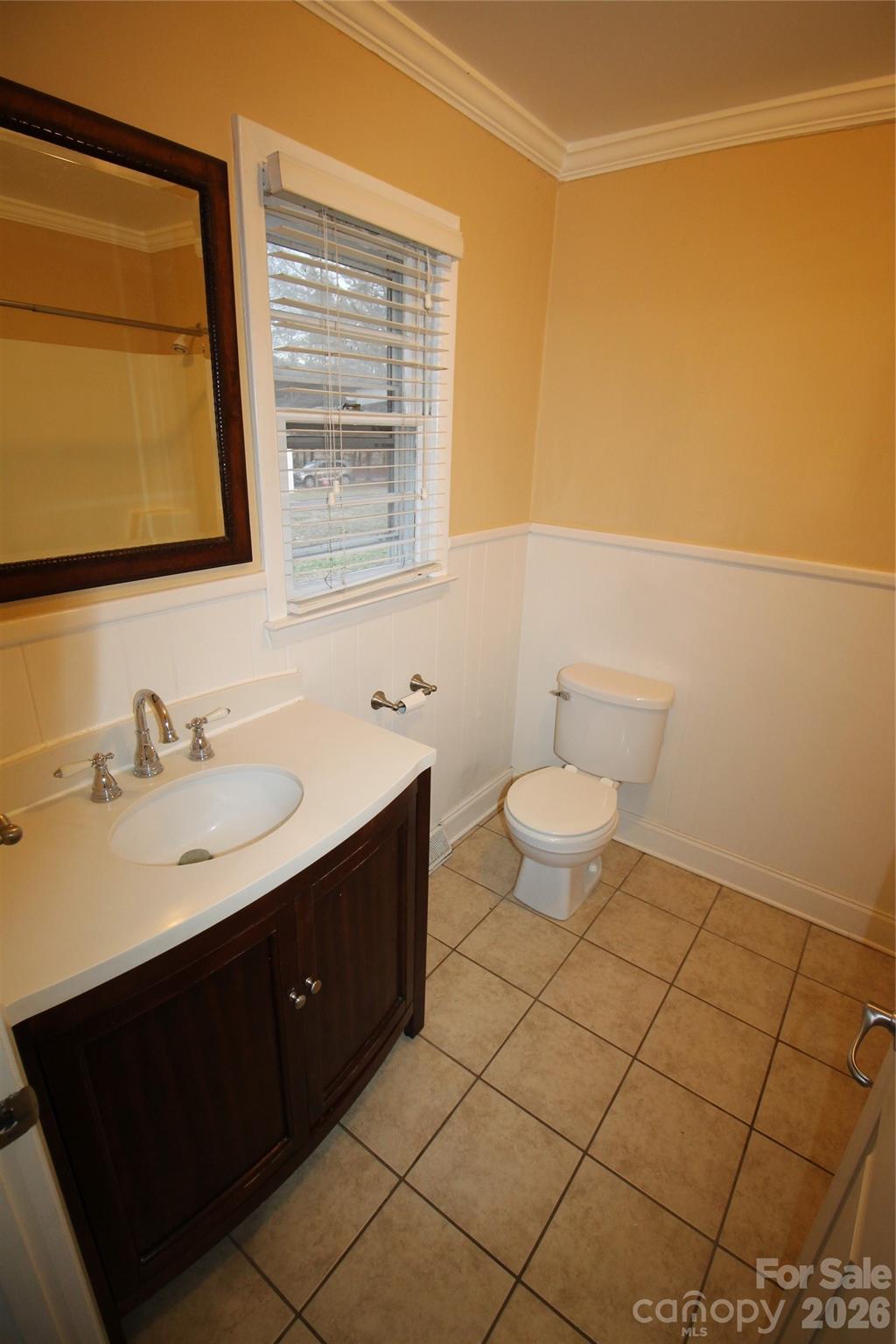 203 Ratchford Farm Road Gastonia, NC 28056 - Photo 8 of 25 a bathroom with a sink vanity and a toilet