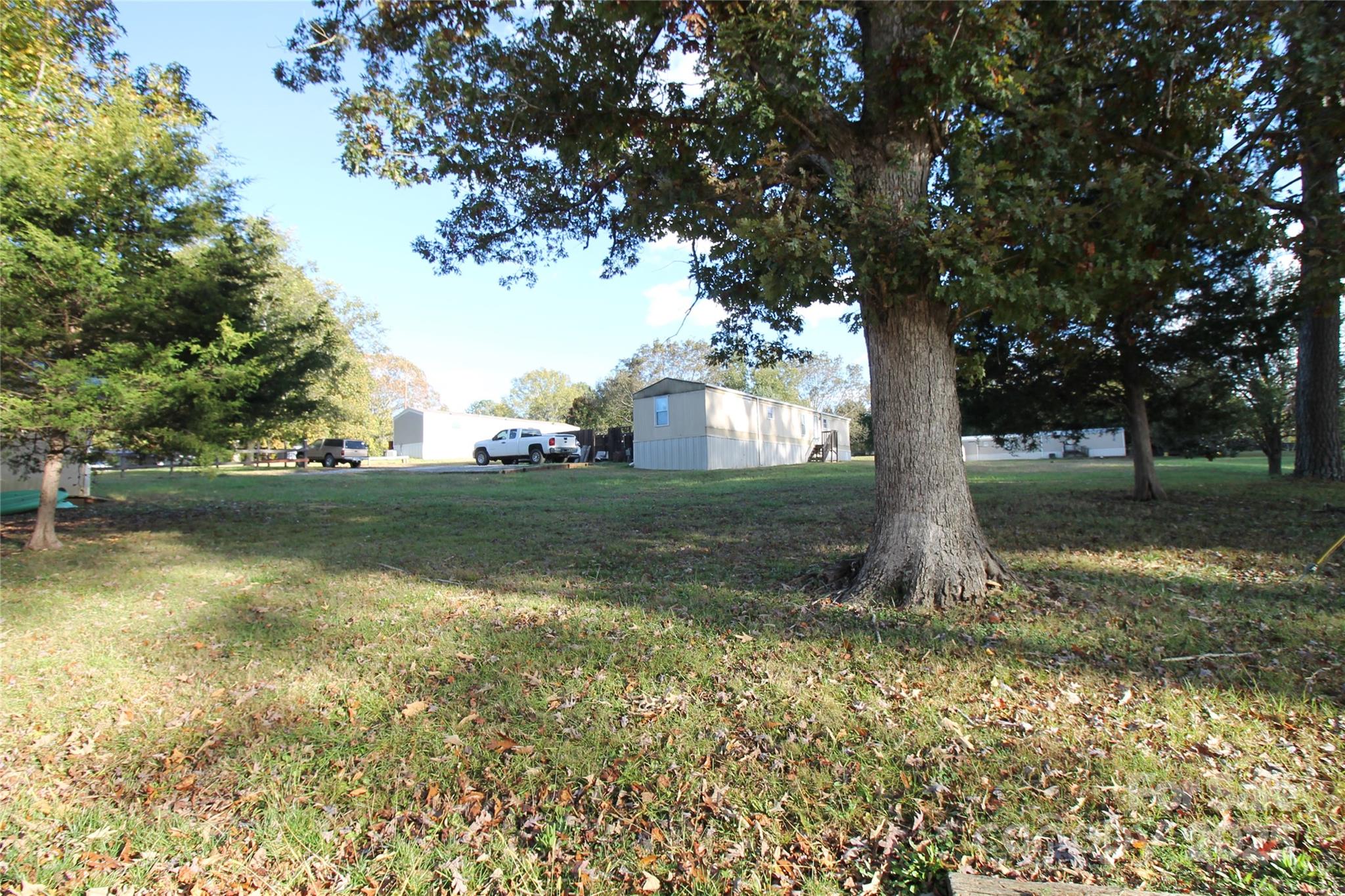 203 Ratchford Farm Road Gastonia, NC 28056 - Photo 9 of 16 a view of backyard with tree