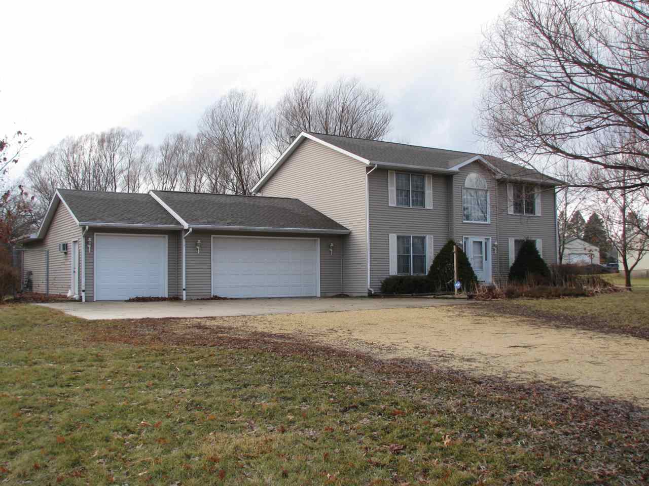 1123 South Weldon Road Rockford, IL 61102 - Photo 1 of 19 a front view of a house with a yard and garage