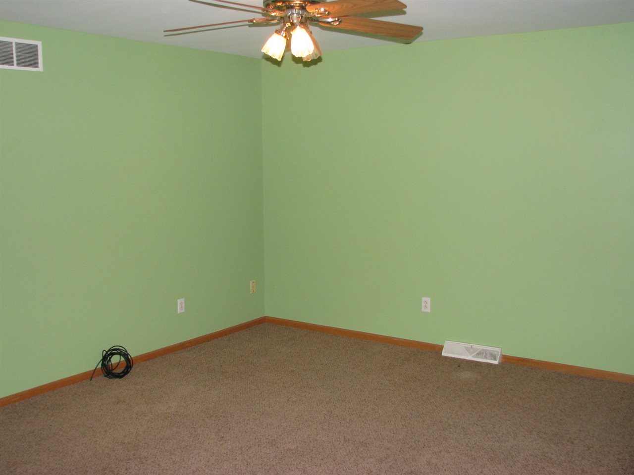 1123 South Weldon Road Rockford, IL 61102 - Photo 4 of 19 a view of an empty room with a chandelier fan