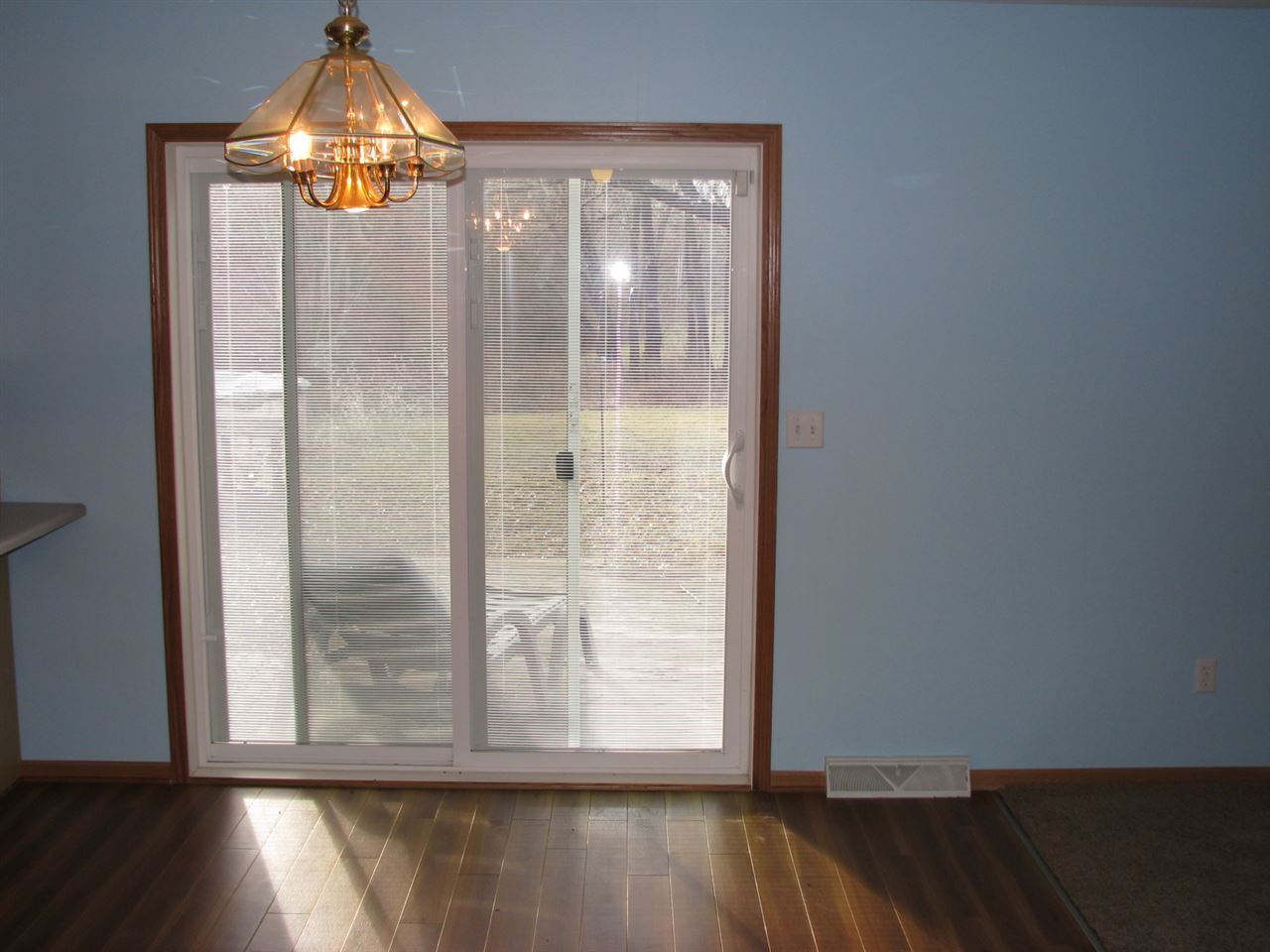 1123 South Weldon Road Rockford, IL 61102 - Photo 10 of 19 a view of empty room with wooden floor and door