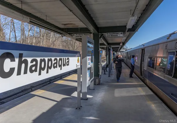 a city street lined with buildings and cars