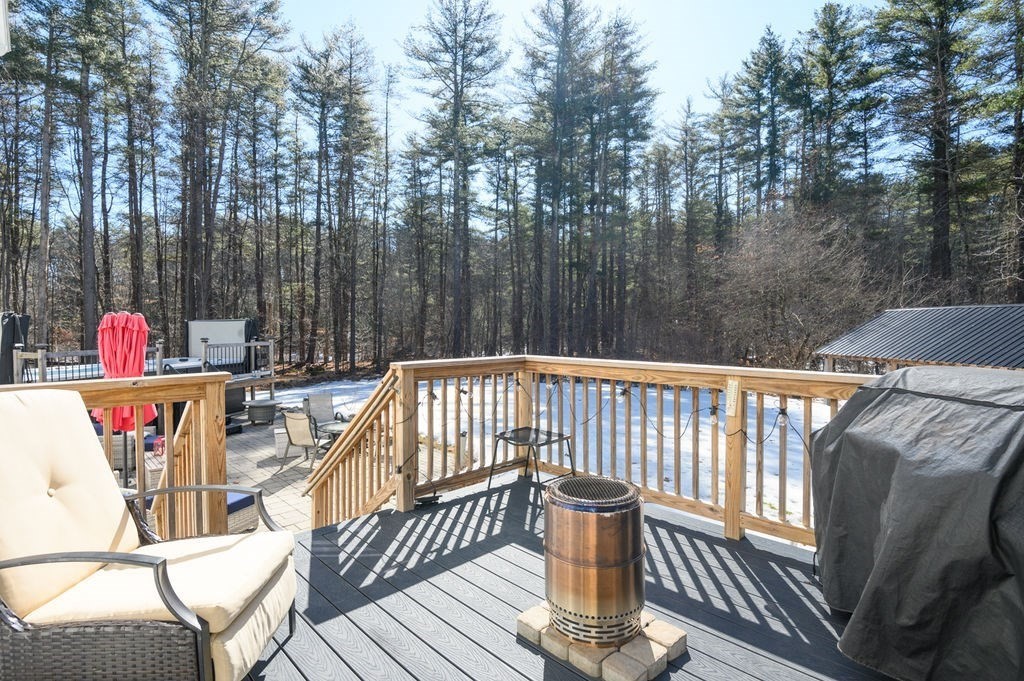 600 Wethersfield Street Rowley, MA 01969 - Photo 11 of 42 a view of balcony with wooden floor and outdoor seating