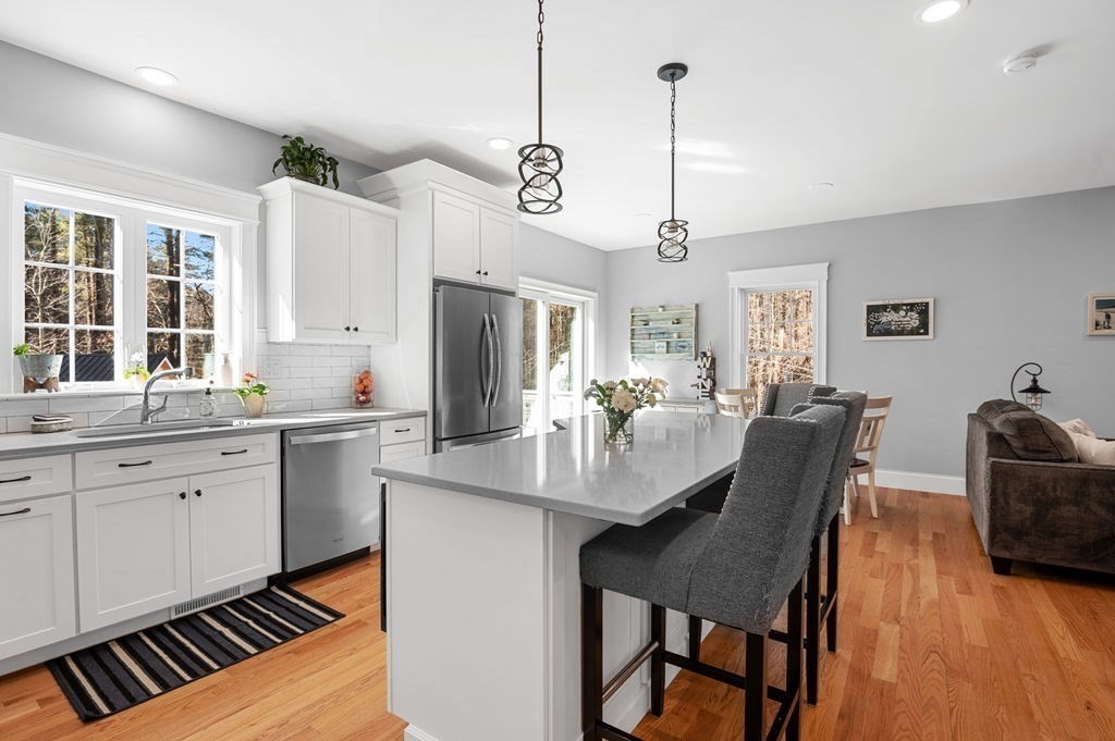 600 Wethersfield Street Rowley, MA 01969 - Photo 19 of 42 a view of kitchen center island dining table wooden floor and window