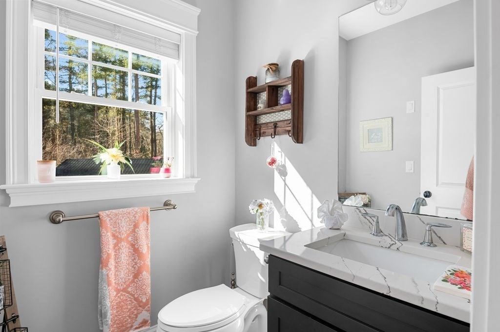 600 Wethersfield Street Rowley, MA 01969 - Photo 29 of 42 a bathroom with a granite countertop sink and a mirror