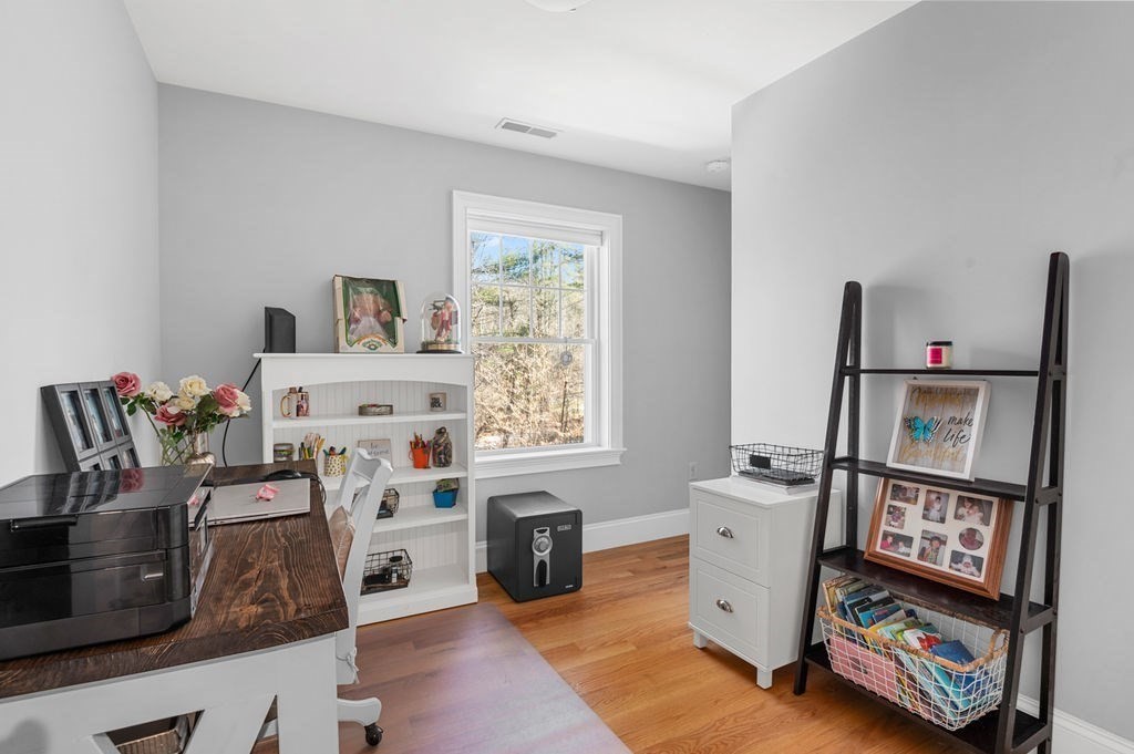600 Wethersfield Street Rowley, MA 01969 - Photo 34 of 42 a room with furniture a rug toys and a window
