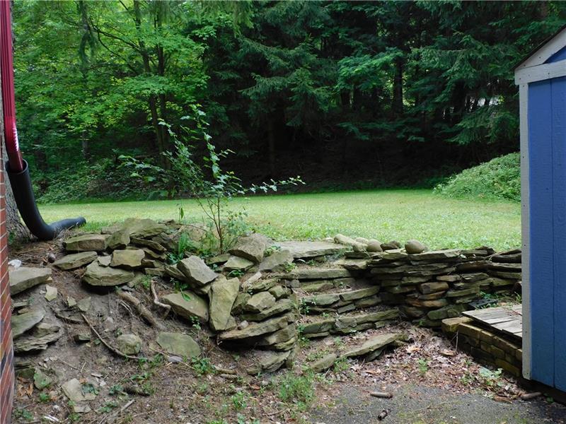 968 Chapel Road Monaca, PA 15061 - Photo 4 of 23 Beautiful stone entry into a tabletop backyard.